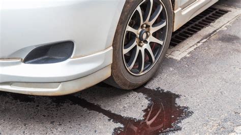 reddish brown fluid leaking from car|8 Reasons Your Car May Be Leaking Fluid